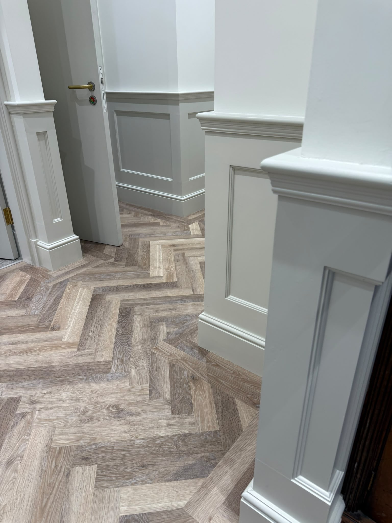 Panelled wainscoting and herringbone flooring, built by Rymax Carpentry and Building